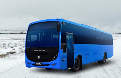 Modern tour bus parked in a snowy alpine setting at Mt Buller